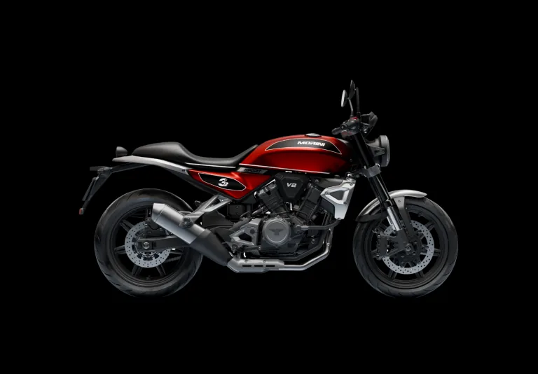 Motorrad in Rot und Schwarz auf schwarzem Grund